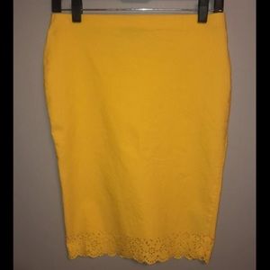 *Knee-Length Yellow Pencil Skirt, Lace Detail.*
